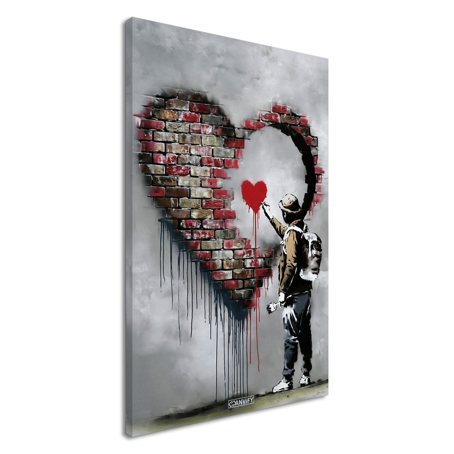 Künstler malt ein kleines rotes Herz in einem großen Herz aus Ziegelsteinen im Banksy Stil auf einer Leinwand