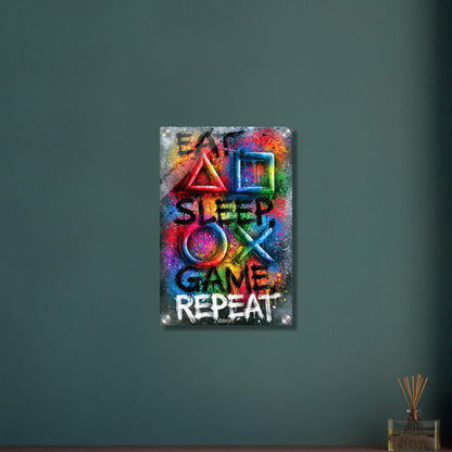 Spruch mit Symbolen der Playstation 'Eat, Sleep, Game, Repeat' mit bunten Farben auf einem Acrylbild