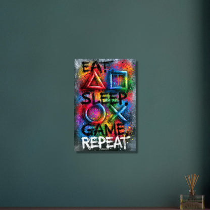 Spruch mit Symbolen der Playstation 'Eat, Sleep, Game, Repeat' mit bunten Farben auf Aluminium