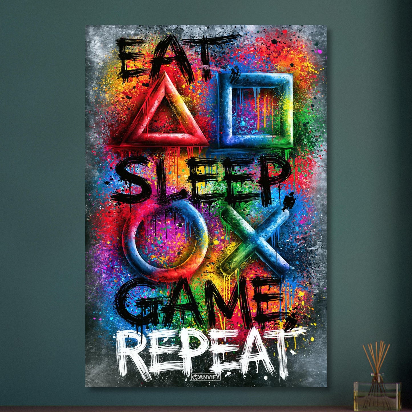 Spruch mit Symbolen der Playstation 'Eat, Sleep, Game, Repeat' mit bunten Farben auf Aluminium