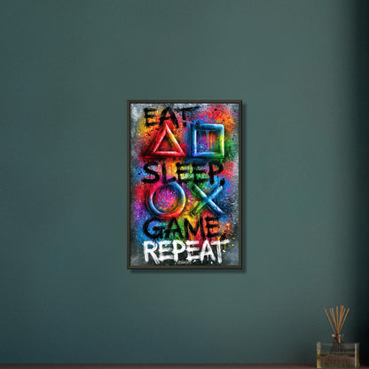 Spruch mit Symbolen der Playstation 'Eat, Sleep, Game, Repeat' mit bunten Farben auf einem Poster im Metallrahmen