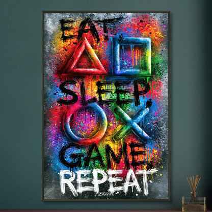 Spruch mit Symbolen der Playstation 'Eat, Sleep, Game, Repeat' mit bunten Farben auf einem Poster im Metallrahmen