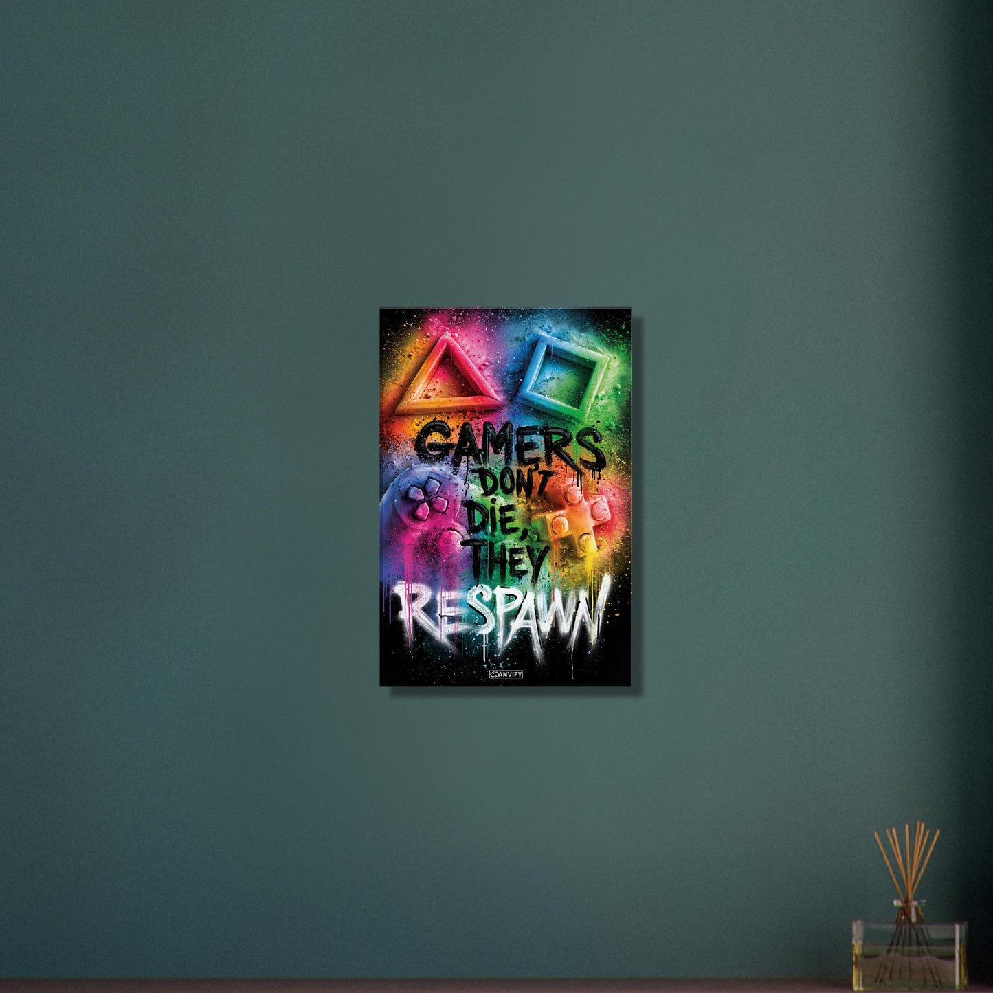 Playstation Controller mit Symbolen und Spruch 'Gamers Don't Die They Respawn' im Graffiti Street Art Stil mit bunten Farben auf einer Leinwand