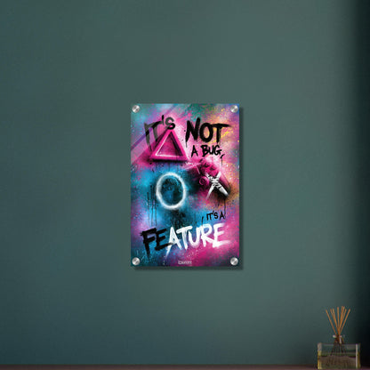 Spruch 'It's Not A Bug It's A Feature' im Graffiti Street Art Stil mit einem Playstation Controller auf einem Acrylbild