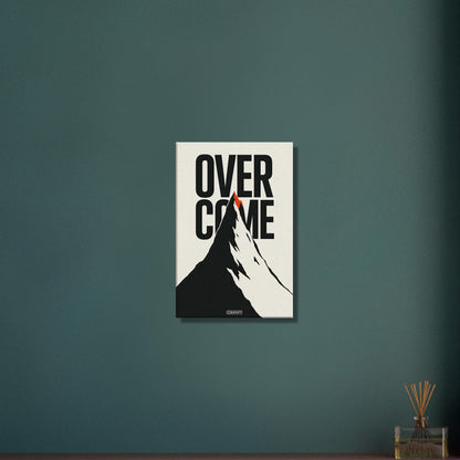 Minimalistisch gezeichneter Berg in Schwarz und Weiß mit einem Spruch 'Overcome' und mit einer roten Bergspitze auf einer Leinwand