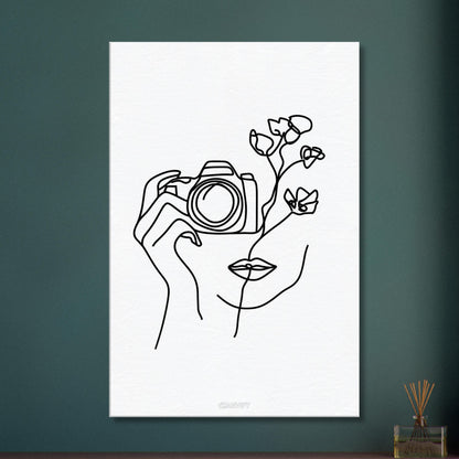 Fotografin mit einer Rose gezeichnet mit einer Linie auf einer Leinwand