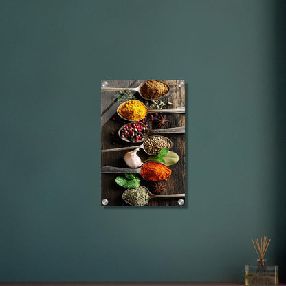 Pfeffer, Harissa, Curry, Kreuzkümmel und Zimt im Löffel auf einem Acrylbild