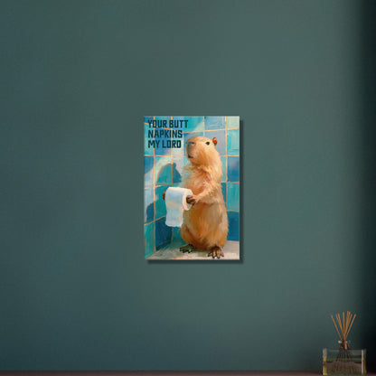 Ein Capybara oder auch Wasserschwein genannt hält eine Klopapierrolle mit einem Spruch 'Your Butt Napkins My Lord' auf einer Leinwand